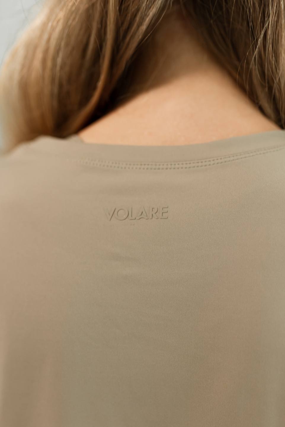 Sand/tan colored flight tee with raised heat transfer