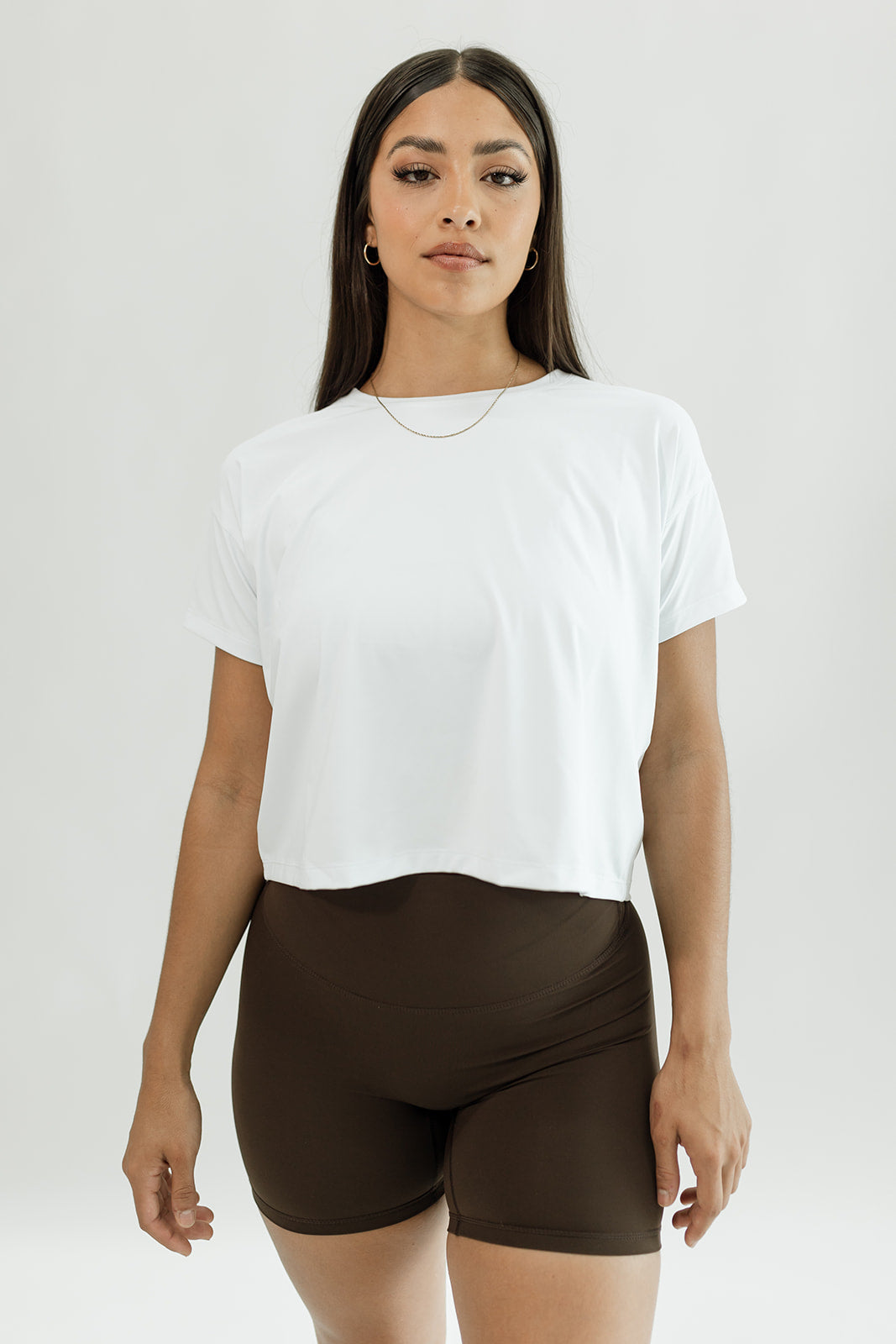 White, lightweight cropped tee shown with cocoa brown biker shorts Volare