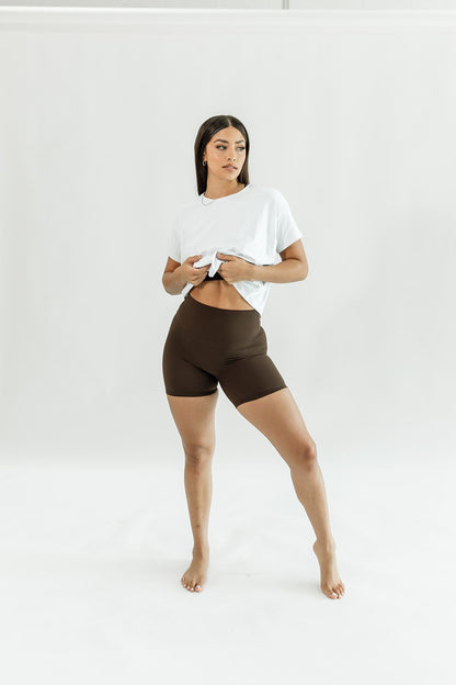 white, soft cropped flight tee shown with cocoa brown biker shorts